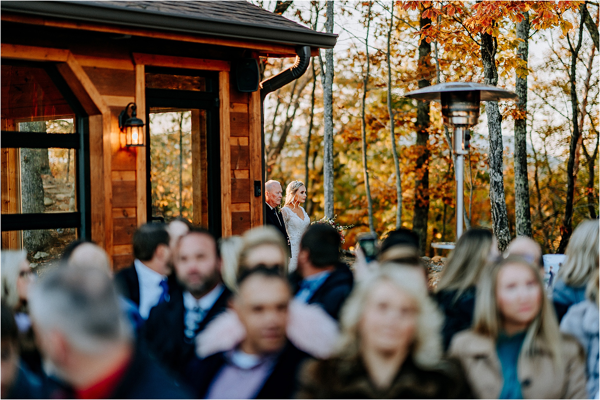 bride walking down aisle at wedding with father