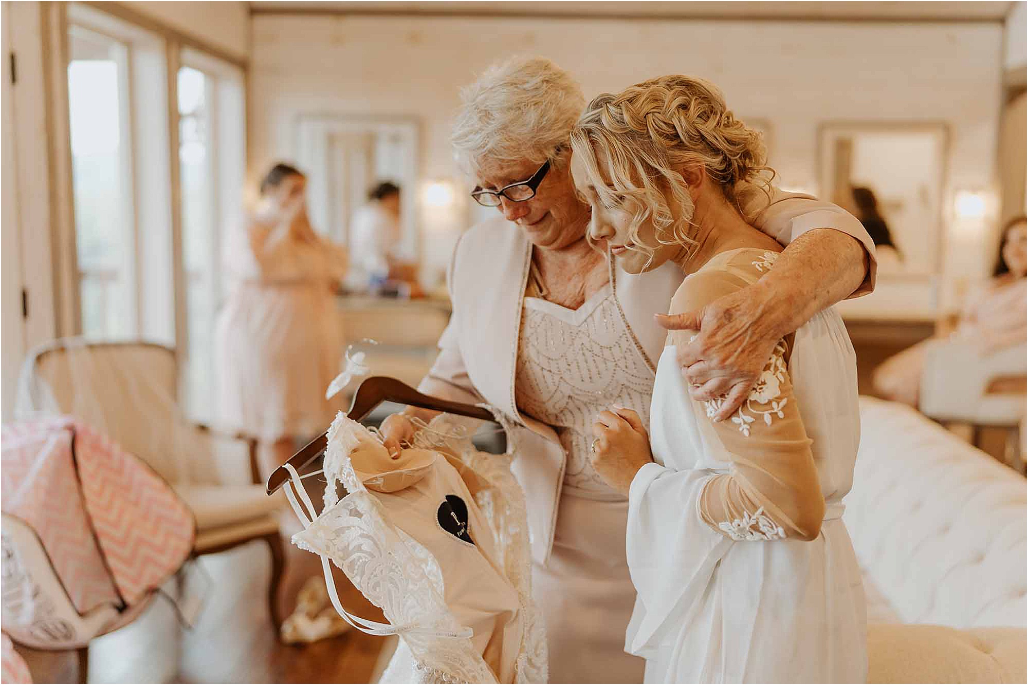 mother and bride hugging