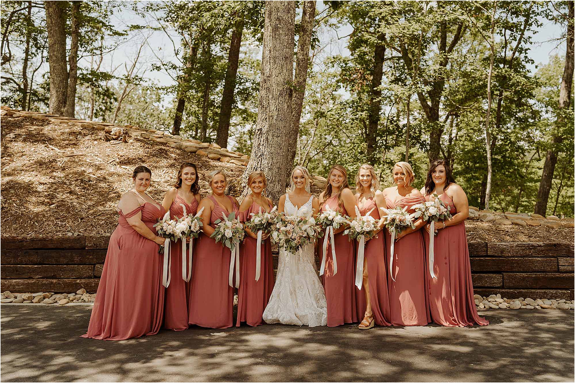 bride and bridesmaids in blush bridesmaids dresses