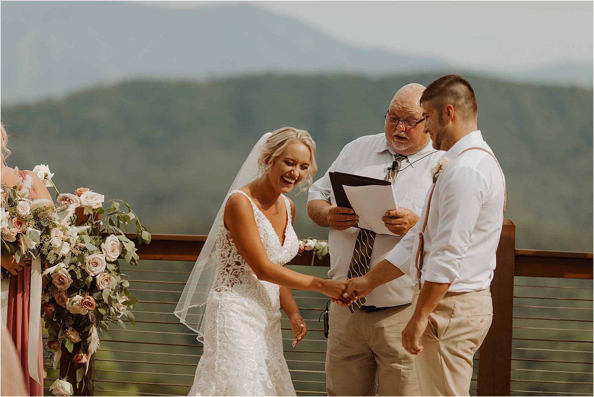 bride laughing at wedding ceremony