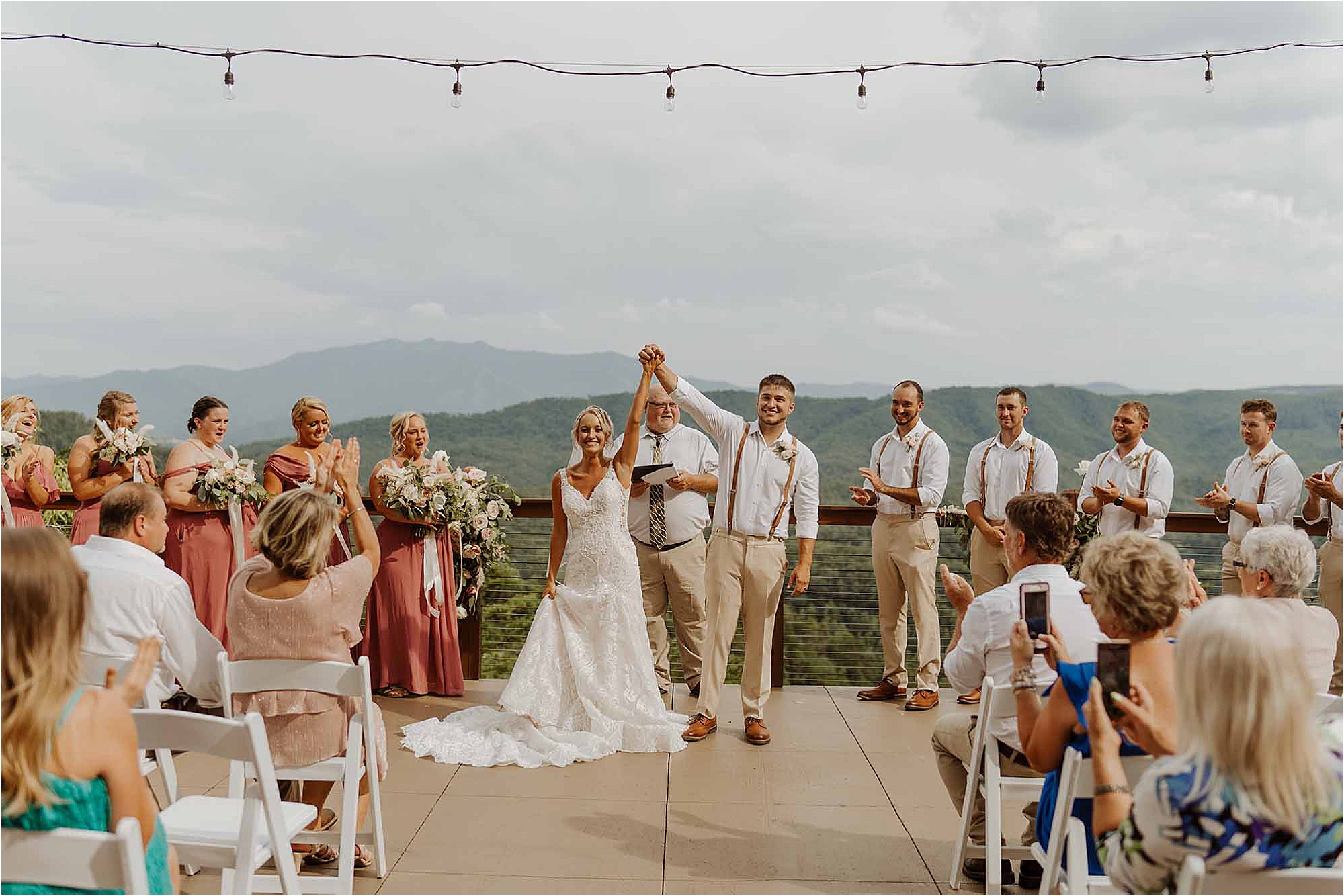 Bride and groom hold hands at wedding ceremony