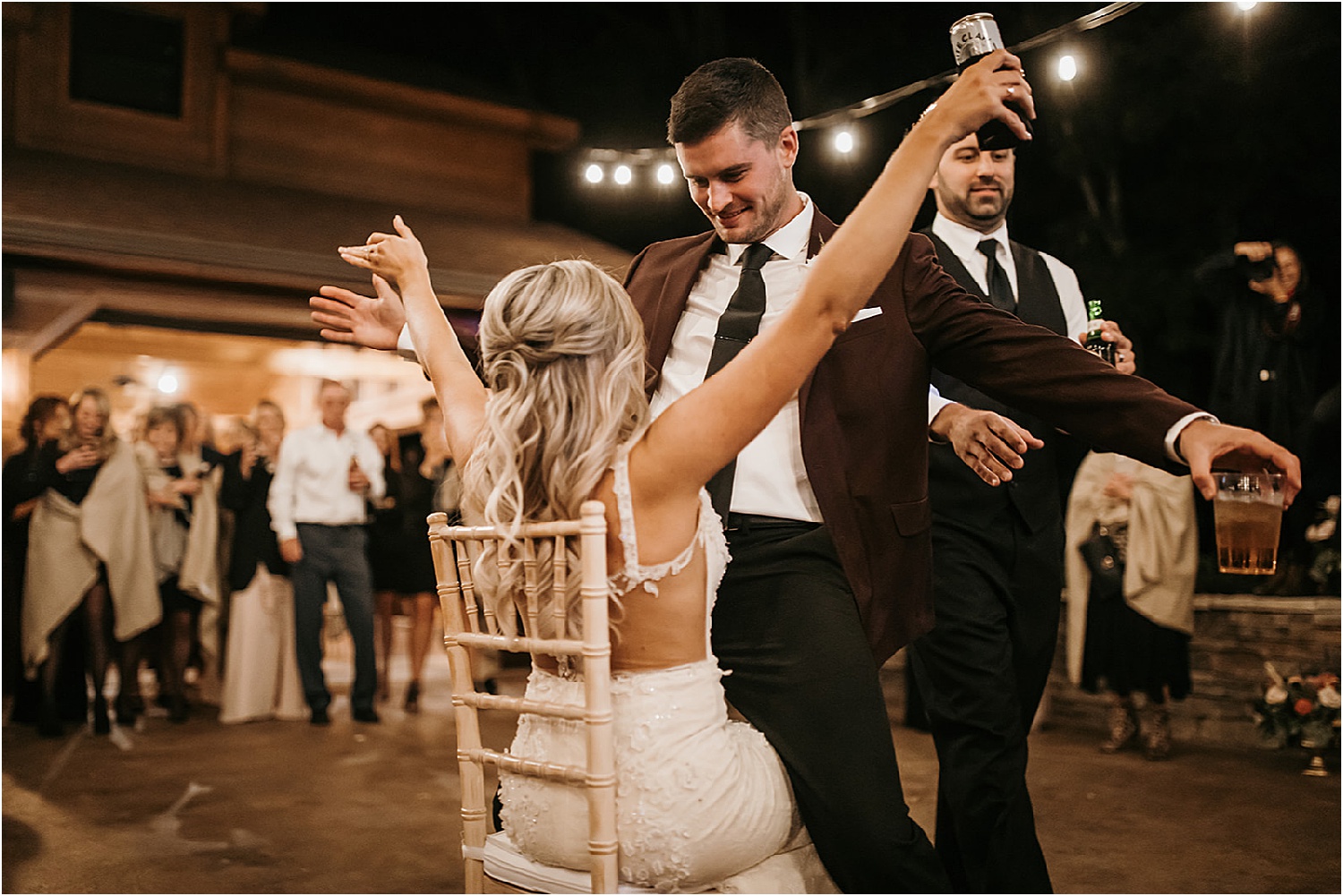groom removes garter at wedding