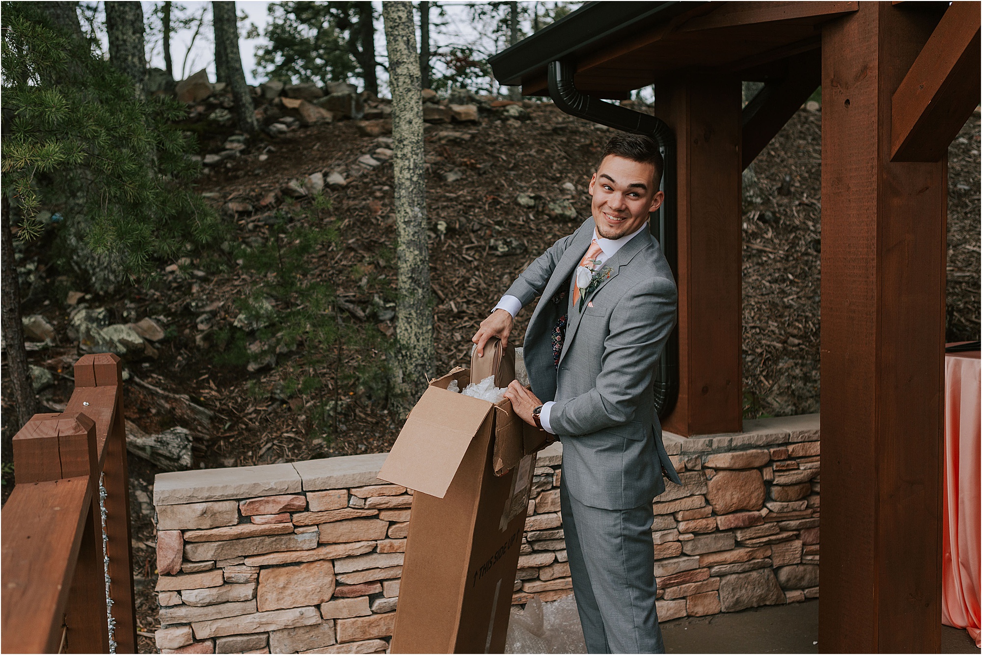 groom opening present at gift-giving wedding