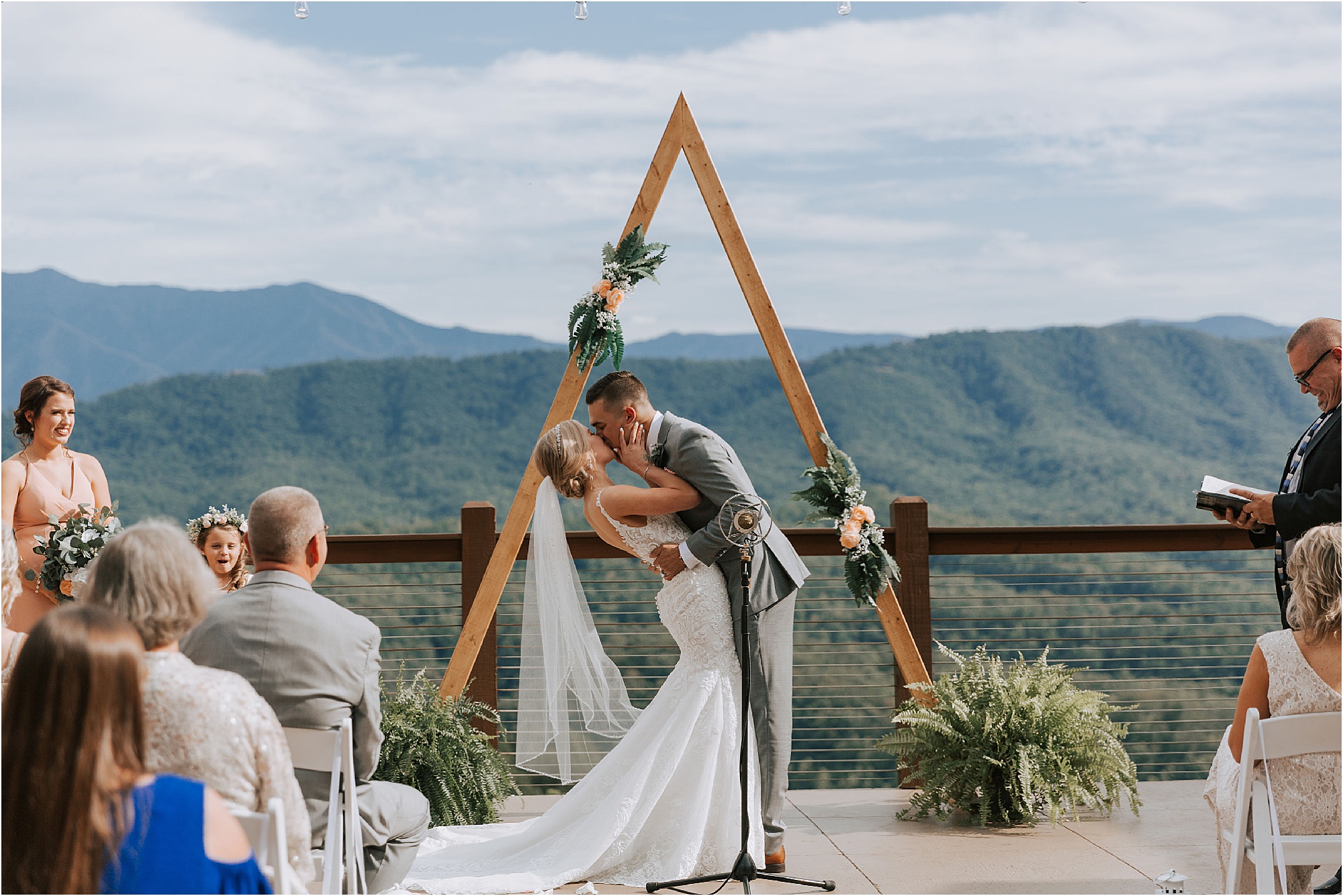 first kiss at gift-giving wedding at The Magnolia Venue