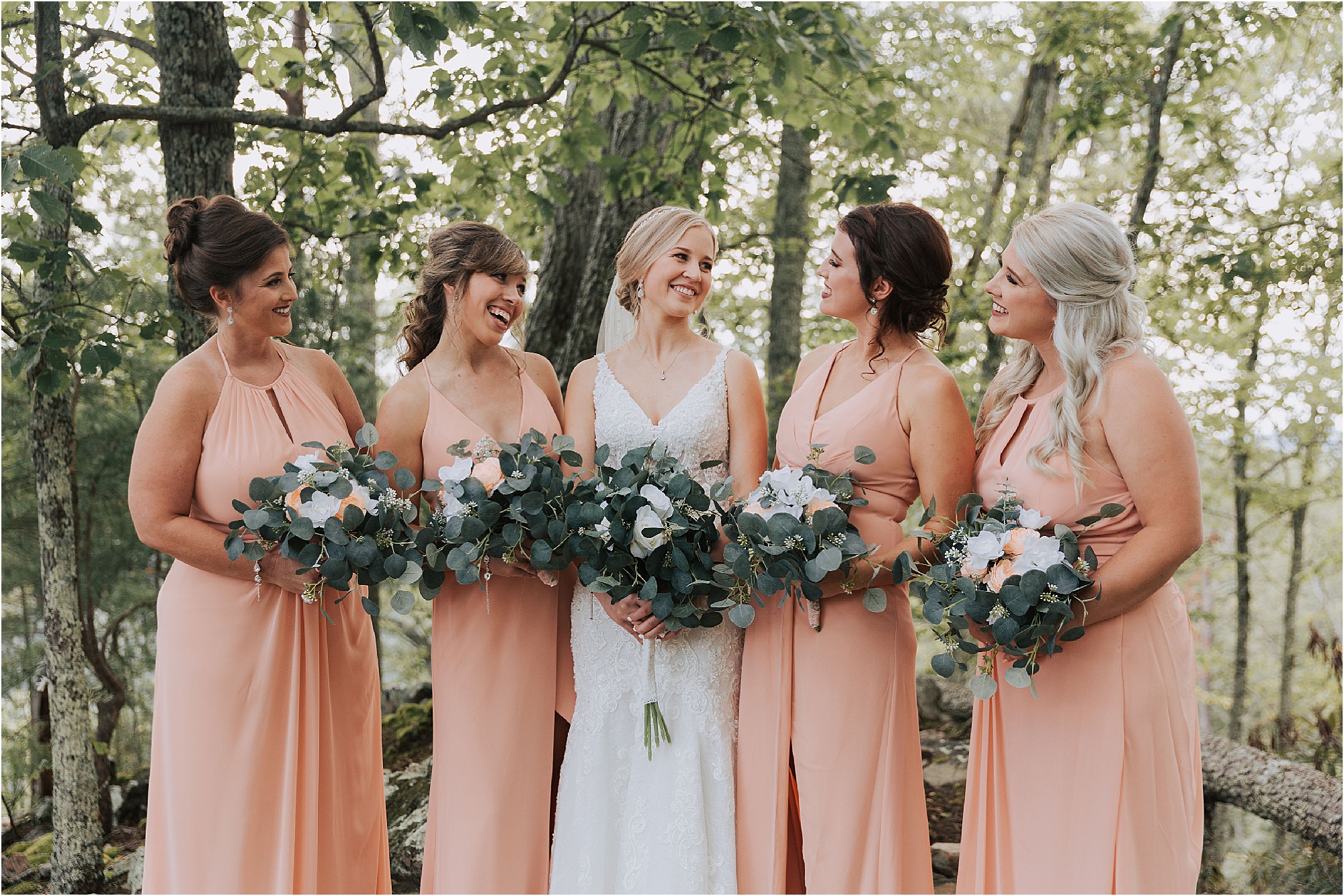 bride and bridesmaids in peach bridesmaids dresses