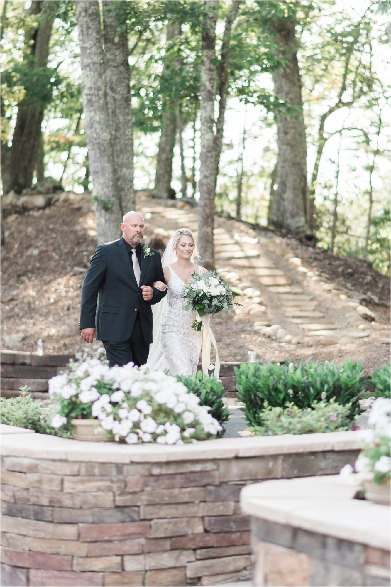 bride walking into wedding ceremony with Father