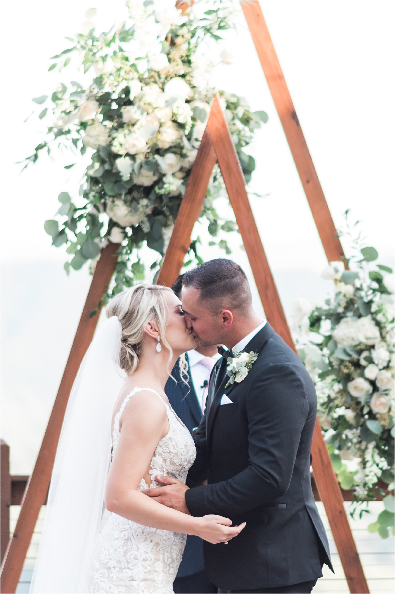 first kiss for bride and groom at Black and White Wedding