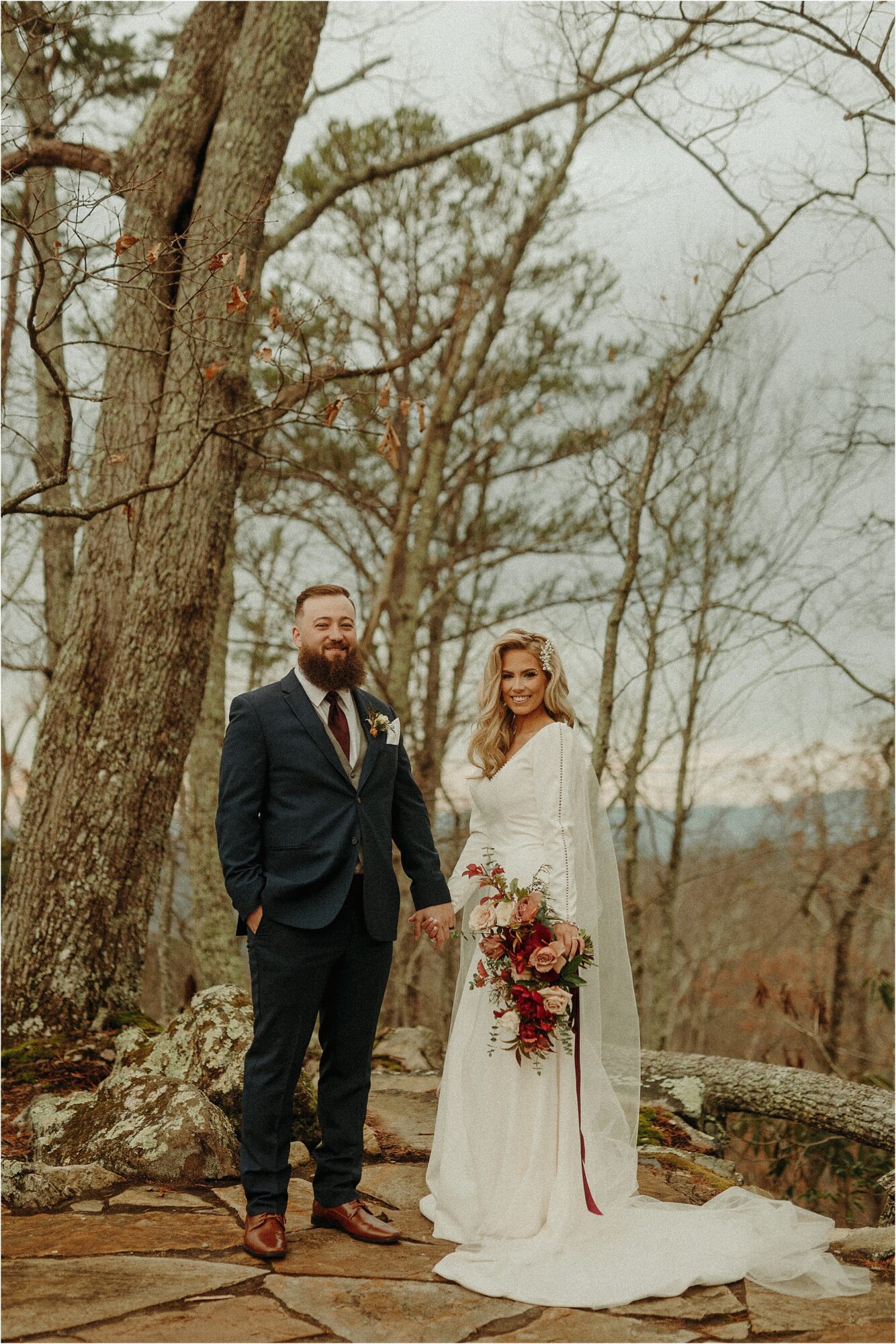 bride and groom holding hands in woods at The Magnolia Venue