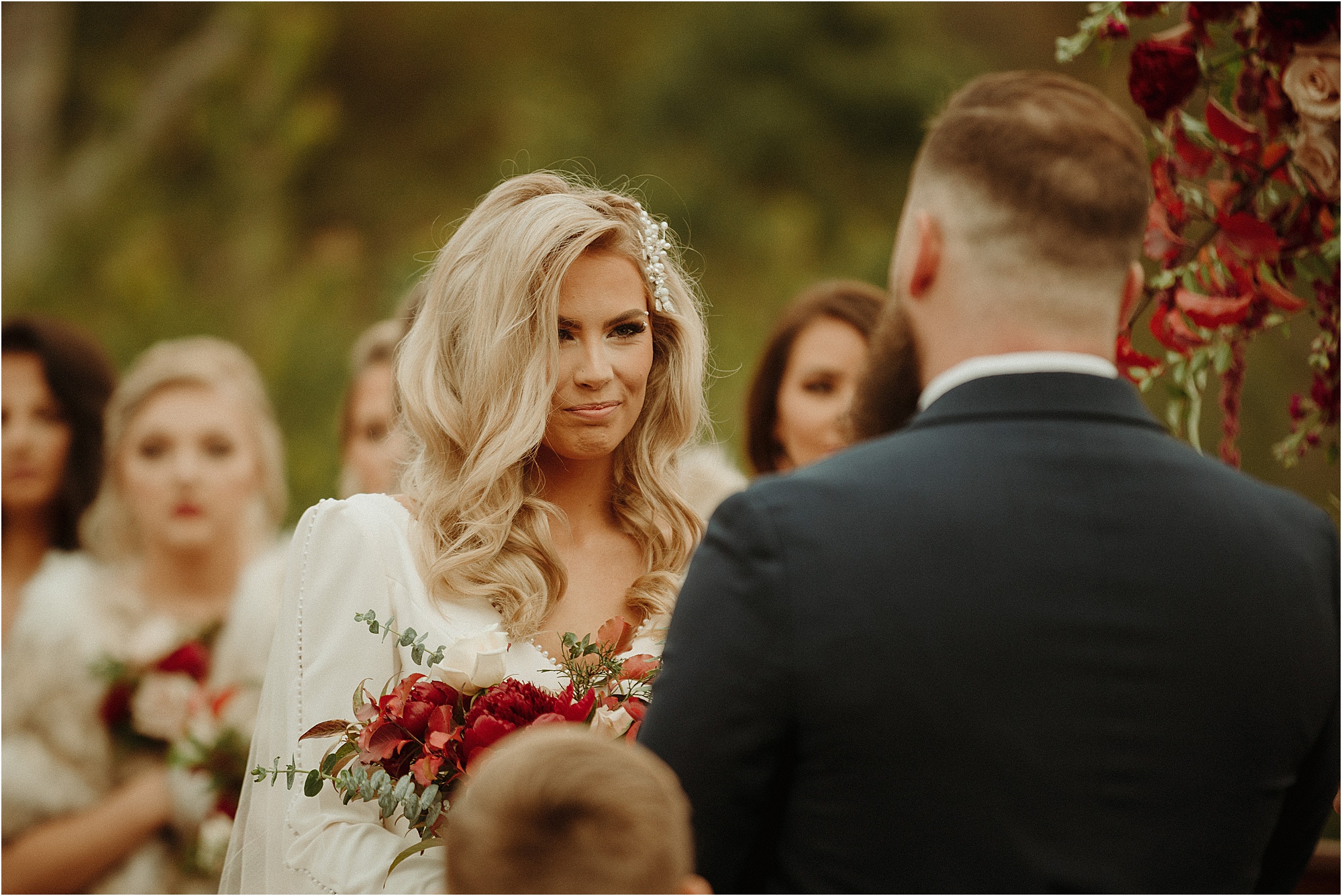 bride reads vows to groom at wedding ceremony