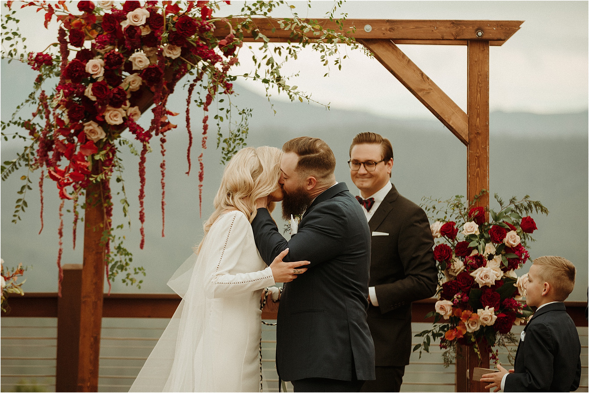 bride and groom first kiss at wedding