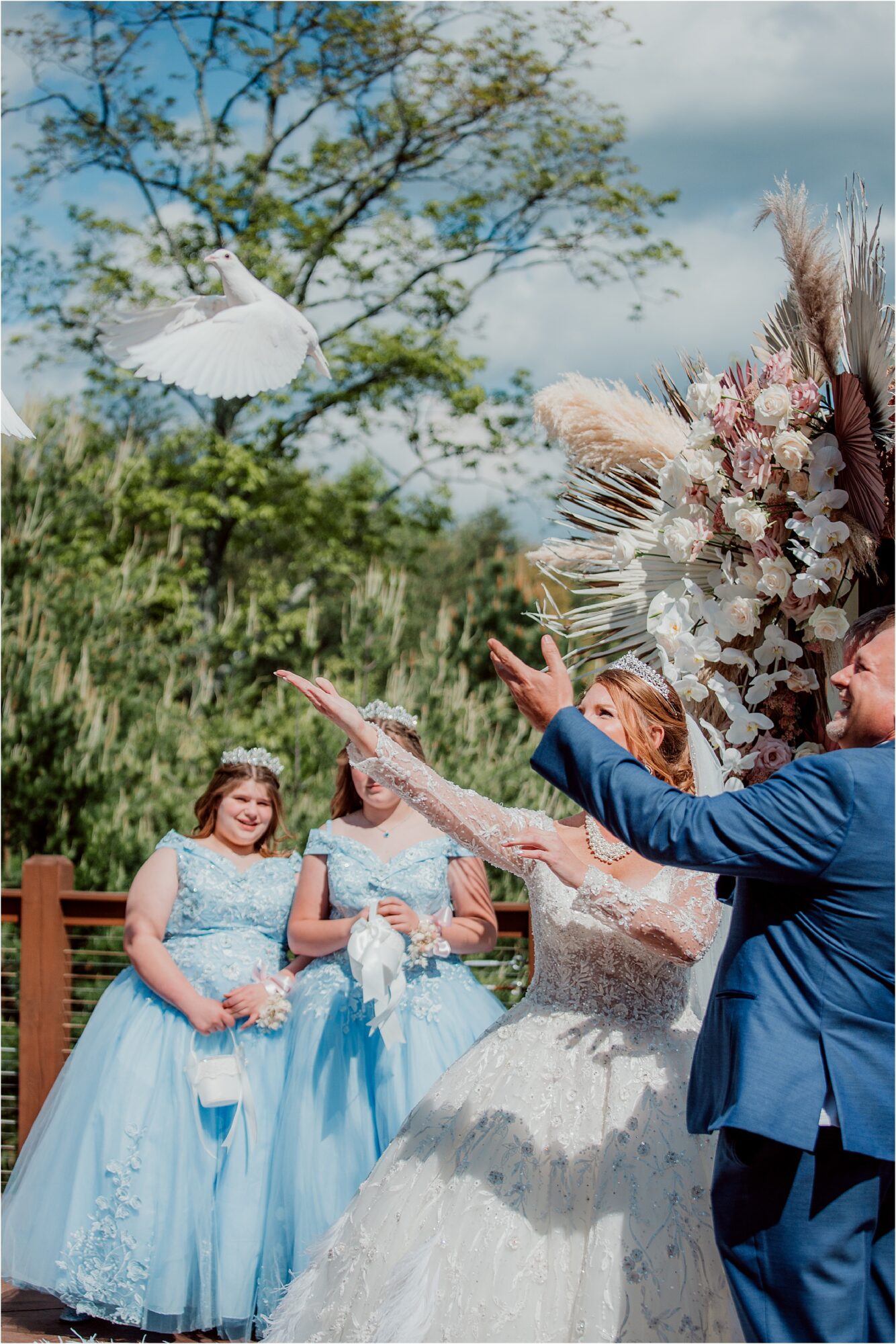 bride and groom release Doves at wedding ceremony