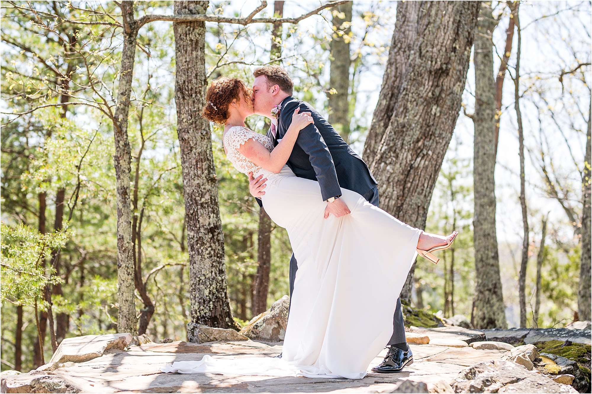 groom dips bride and kisses her