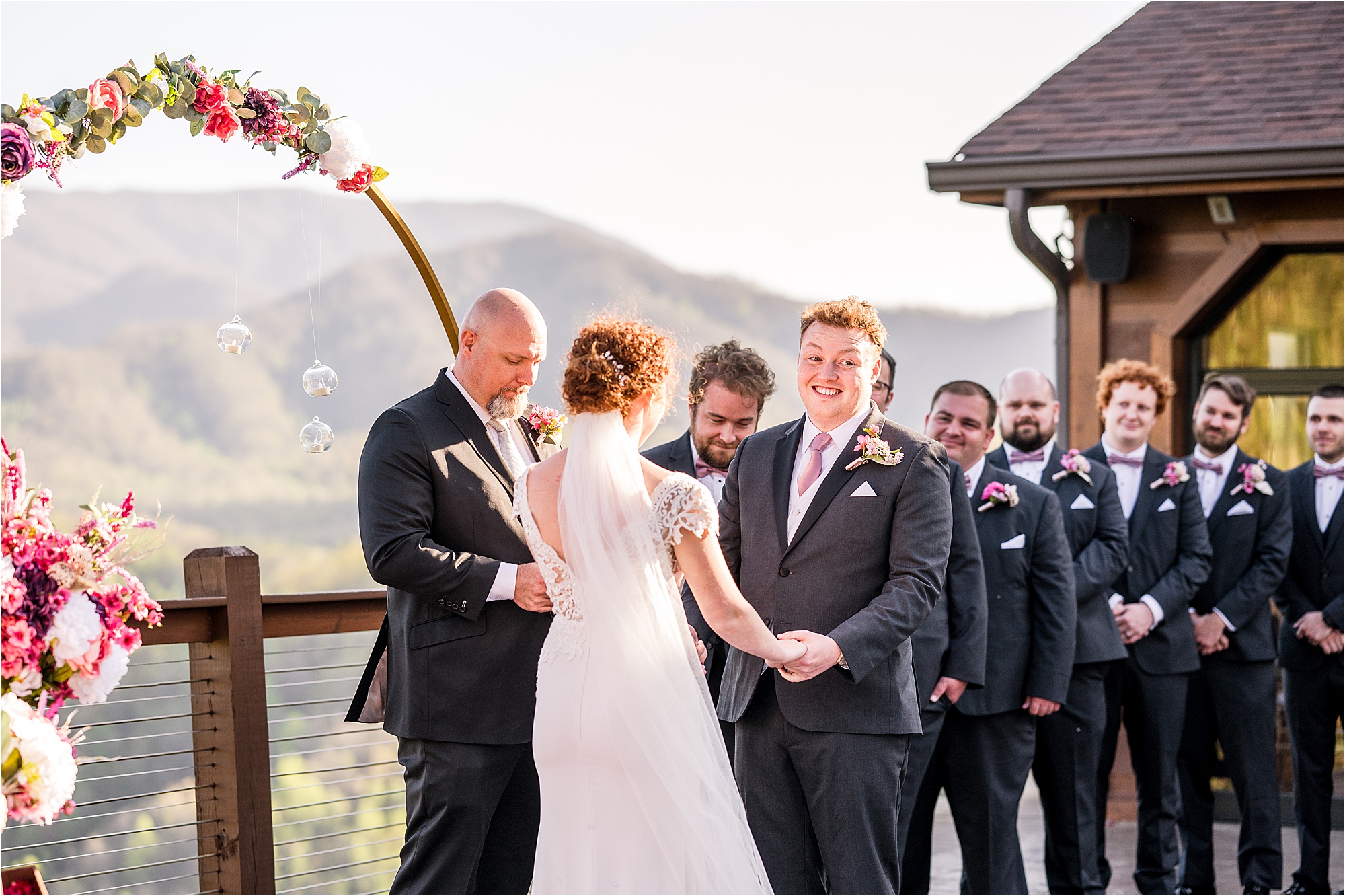 groom laughing at wedding ceremony