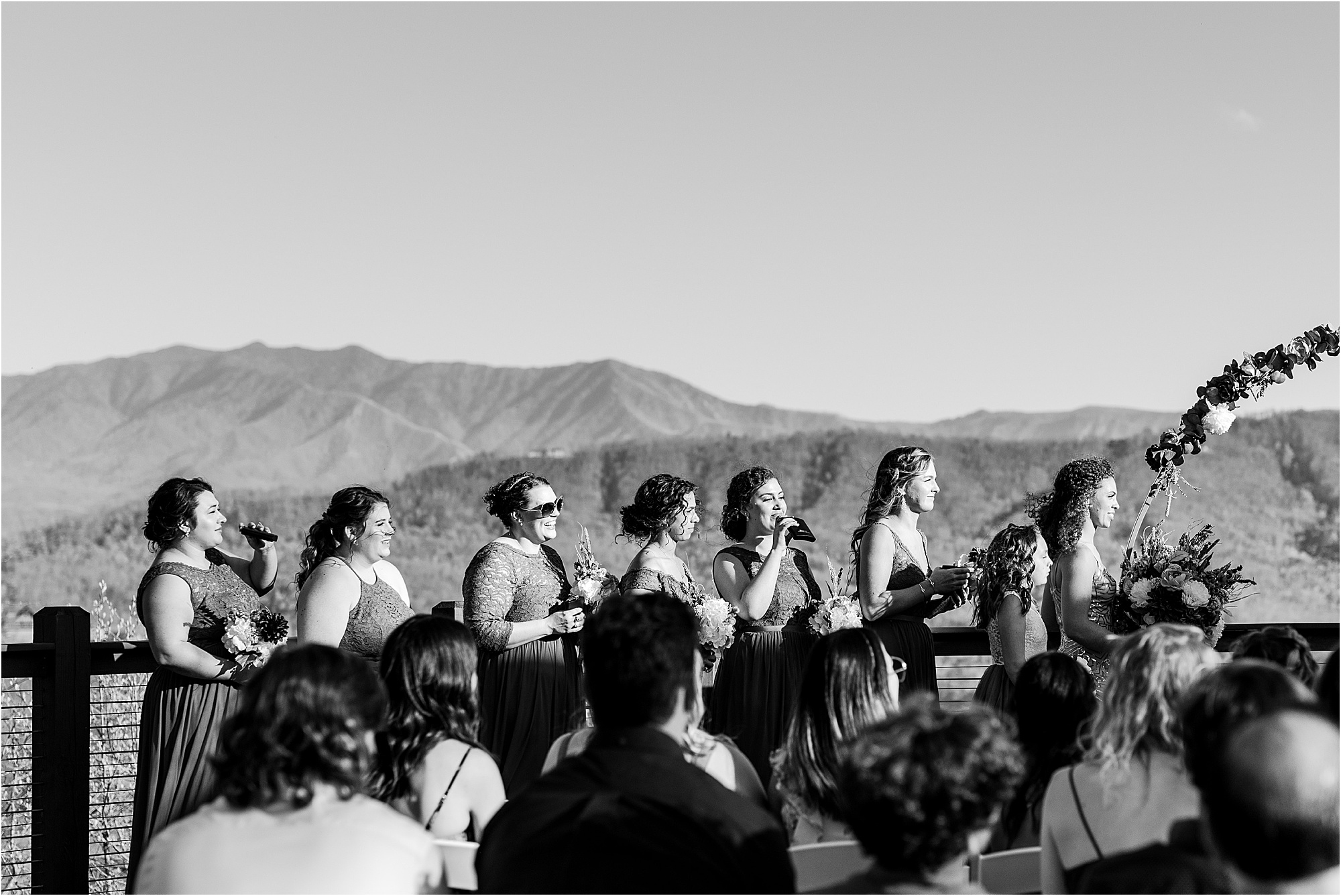 bridesmaids drinking from flasks at wedding ceremony