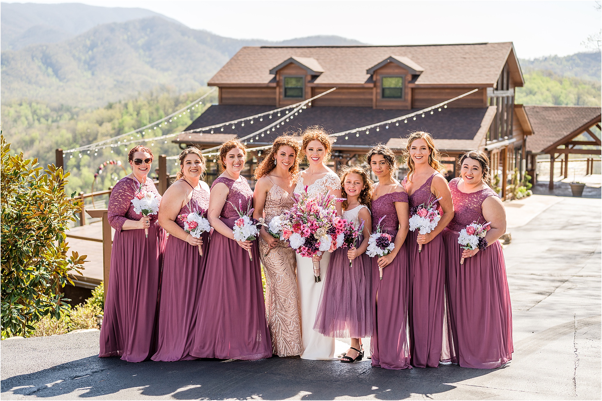 bride and bridesmaid photos with flower girl in purple dresses