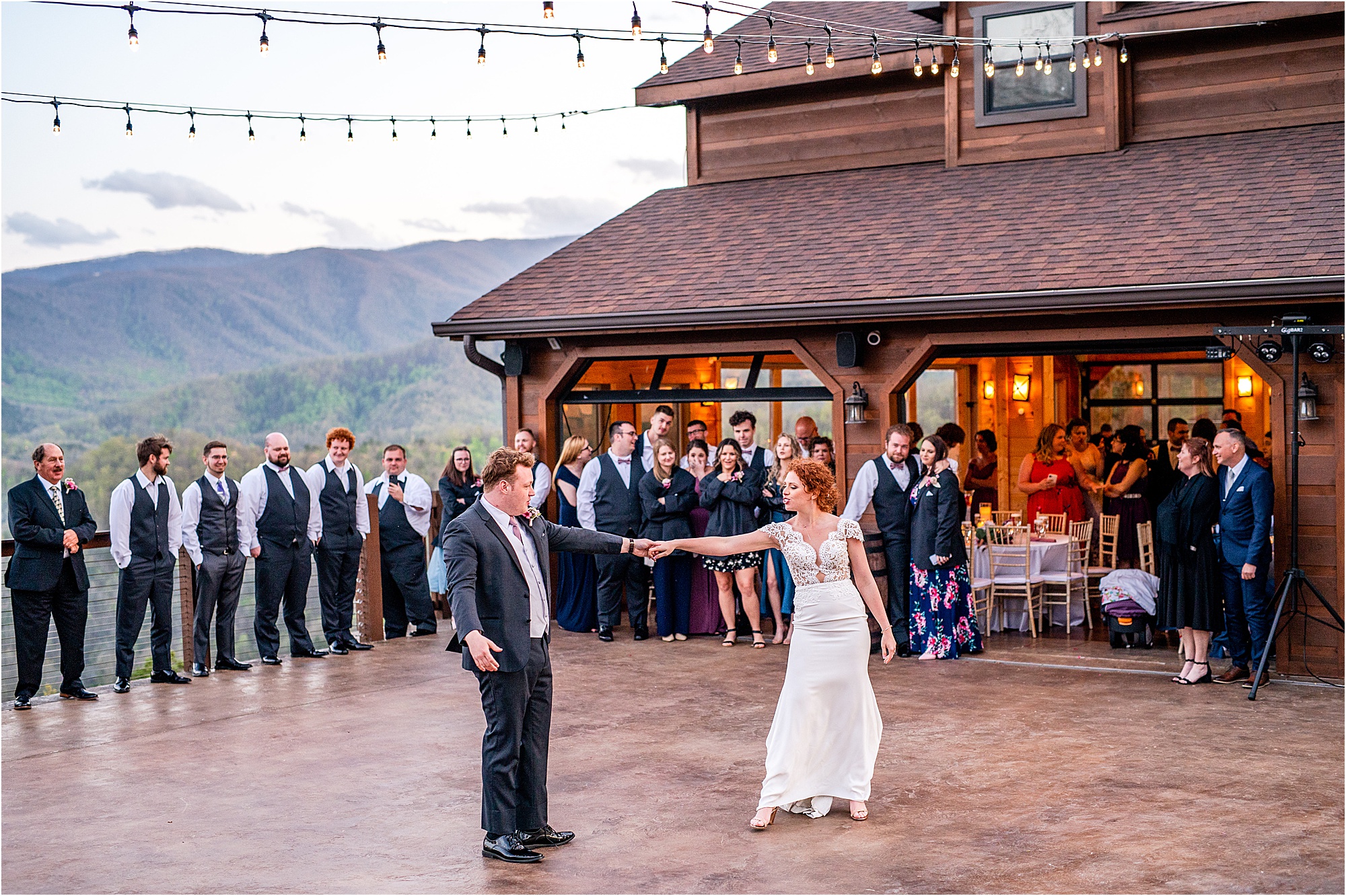 bride and groom first dance on patio overlooking the Smokies