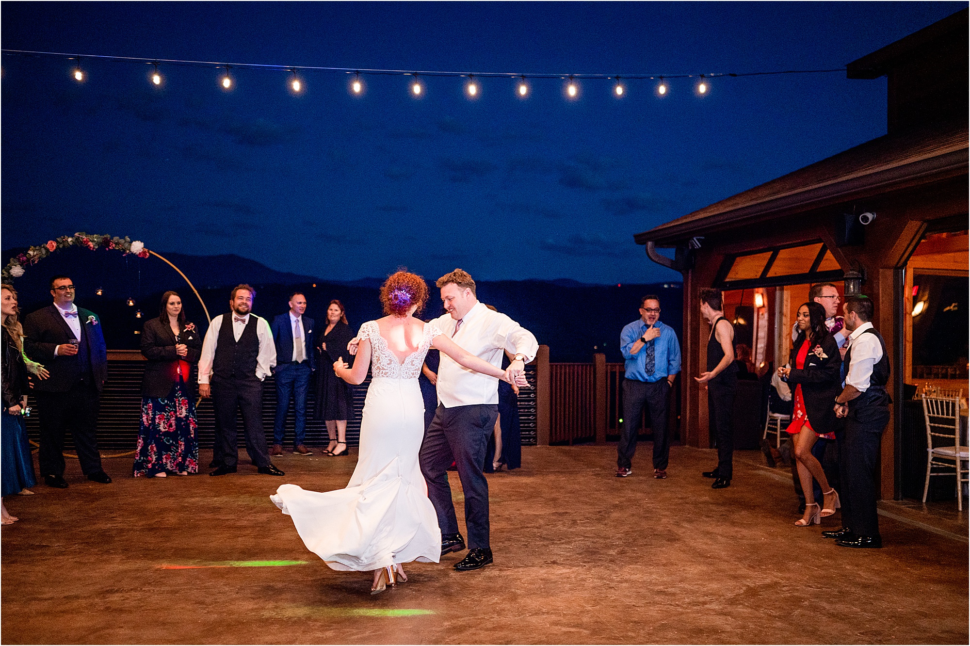 bride and groom first dance on patio overlooking the Smokies