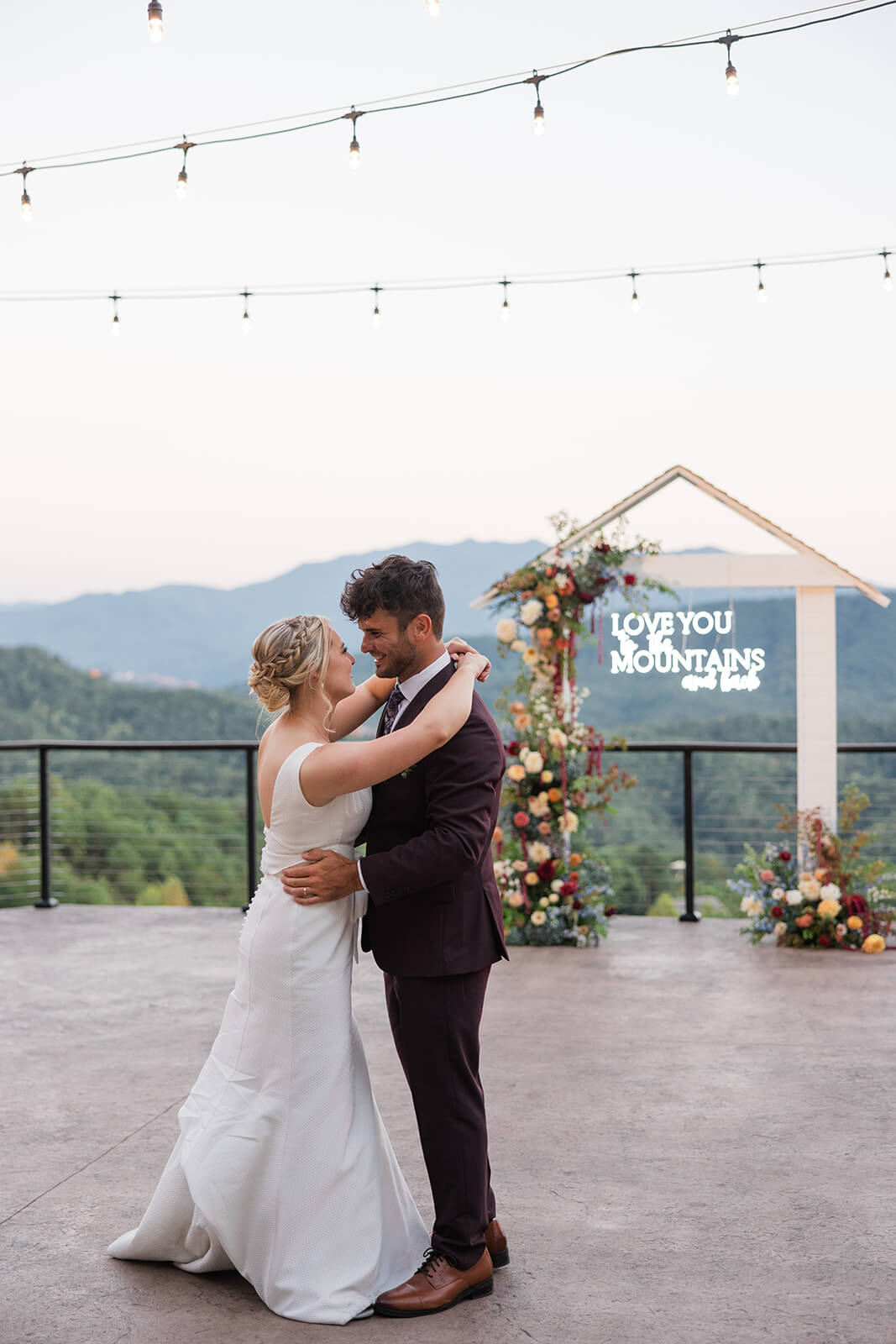 Evening reception under twinkling lights at The Magnolia Venue, a luxury Smoky Mountain wedding venue