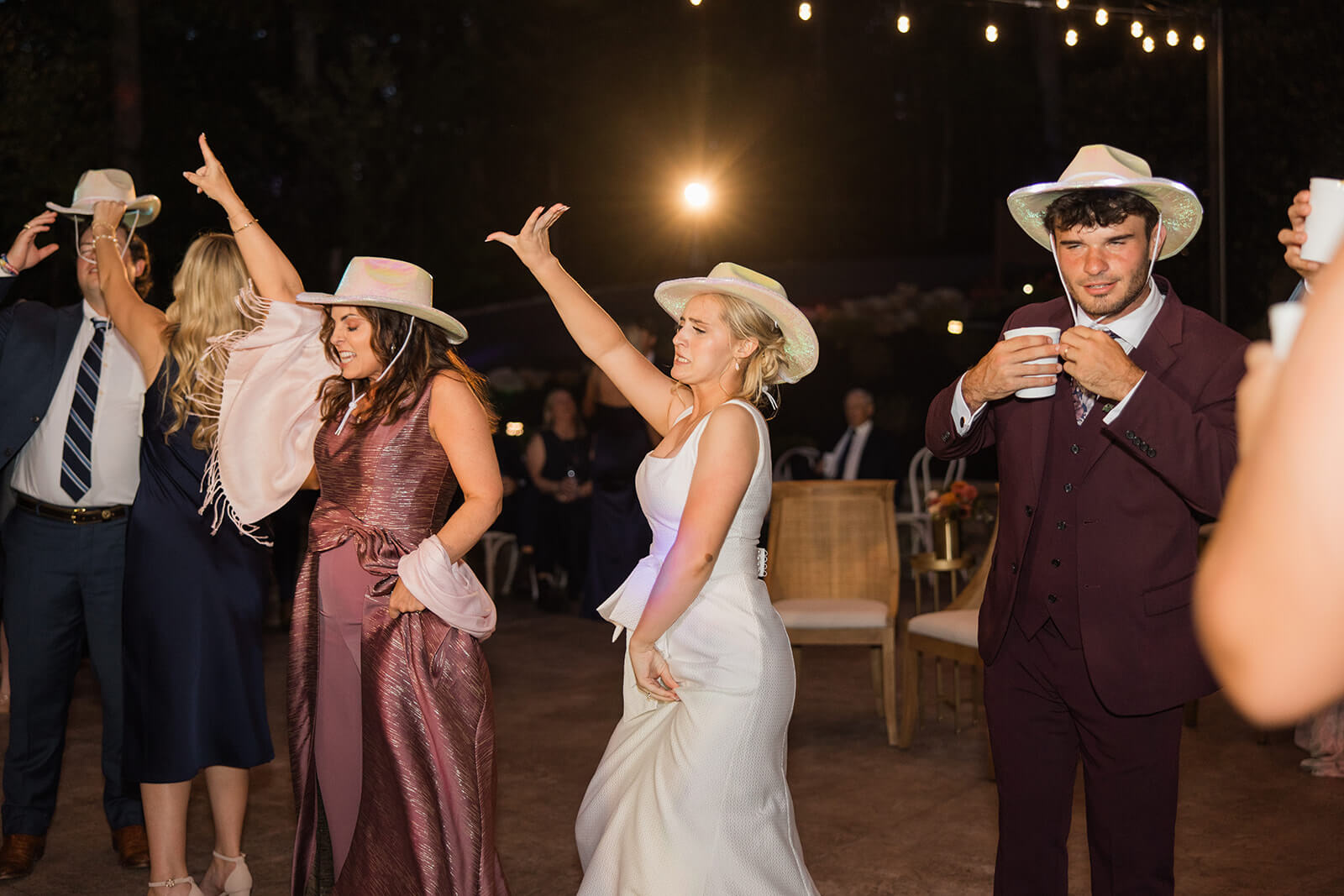 Evening reception under twinkling lights at The Magnolia Venue, a luxury Smoky Mountain wedding venue