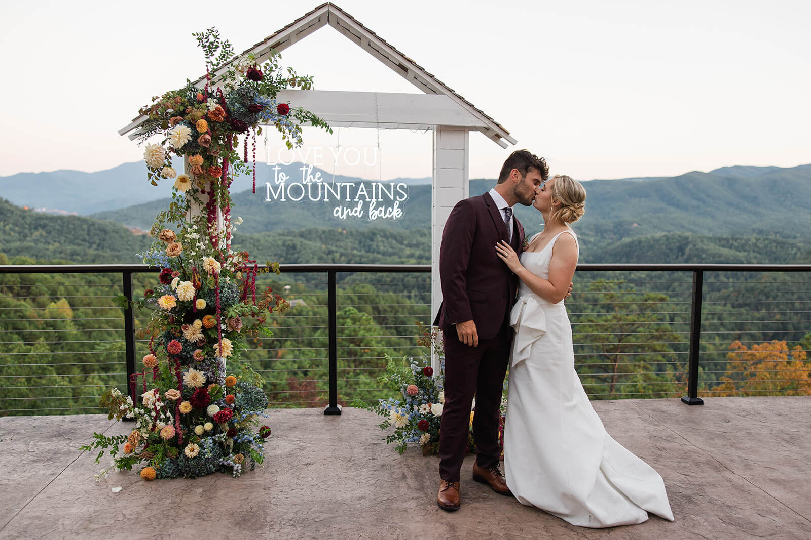 Newlywed portraits framed by sweeping Smoky Mountain vistas at The Magnolia Venue