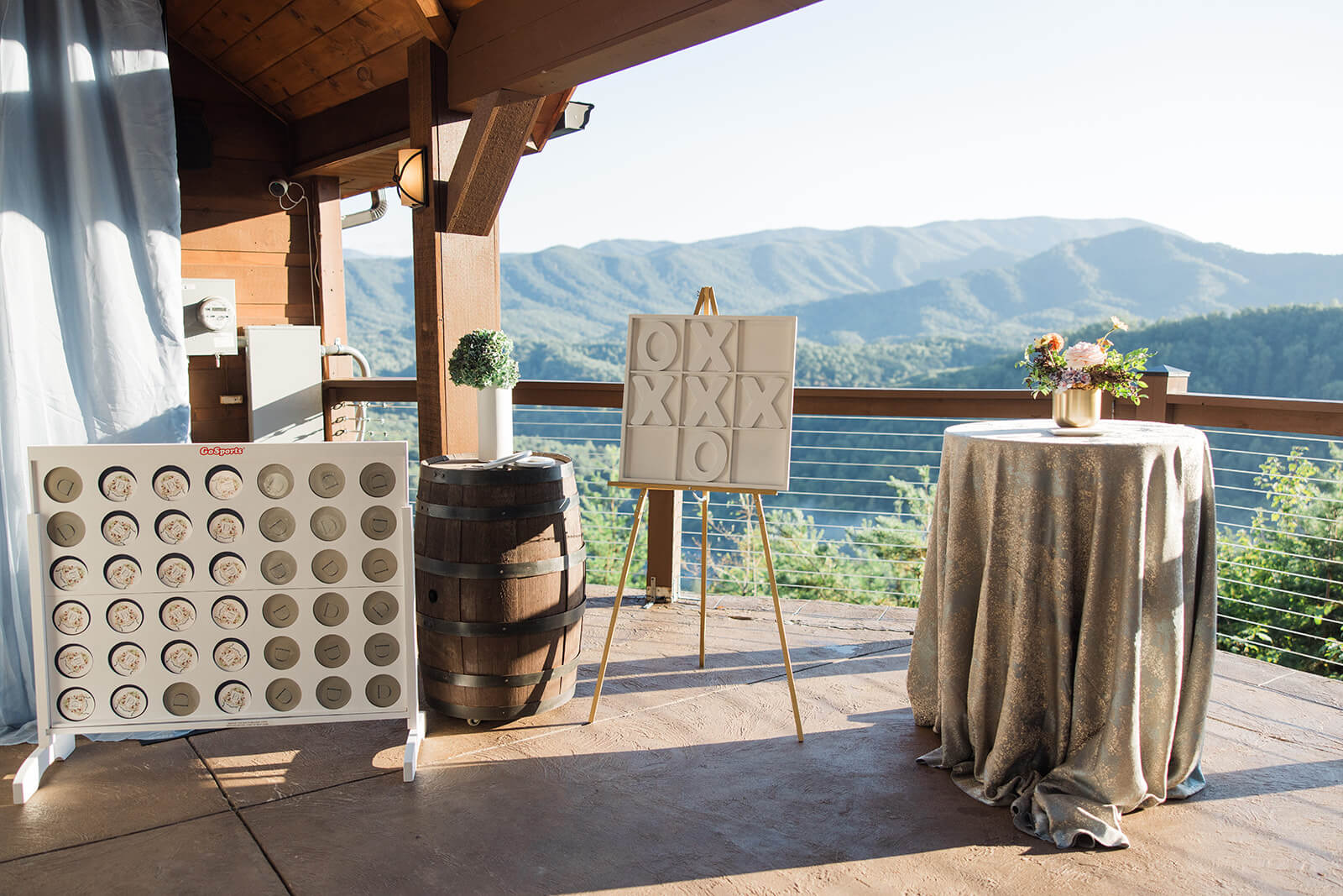 Cocktail hour on the covered patio at The Magnolia Venue with panoramic Smoky Mountain views