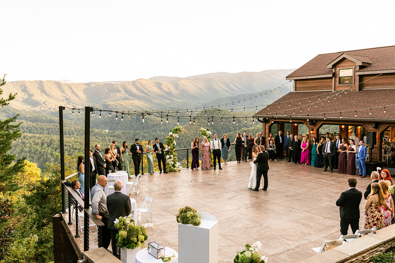 First dance as husband and wife on the Magnolia Venue ceremony patio. A modern mountain wedding reception with gorgeous mountain views.