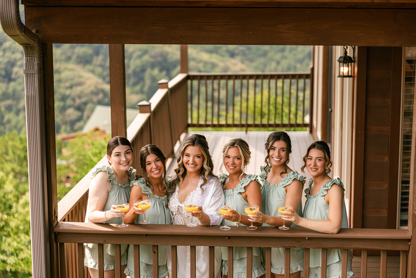 Bride and Bridesmaid enjoy mimosas on the private balcony at The Magnolia Venue