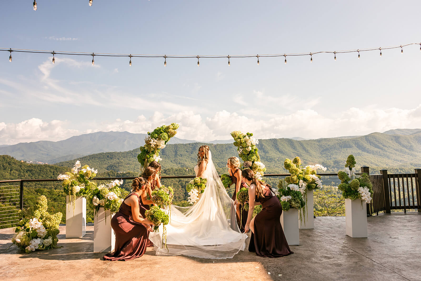 Modern Bride in a Wedding Dress with a Wedding Bouquet standing on the Ceremony patio of the Magnolia wedding venue